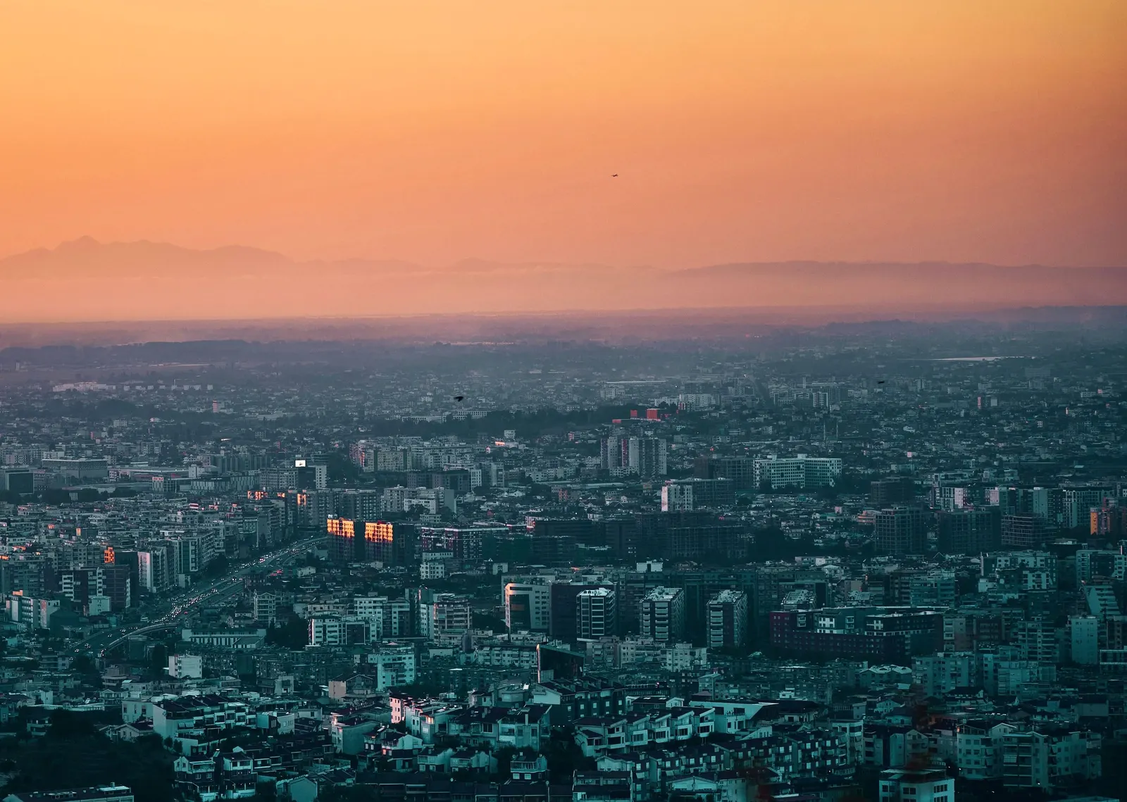Tirana at sunset, with the mountains to the west of the city